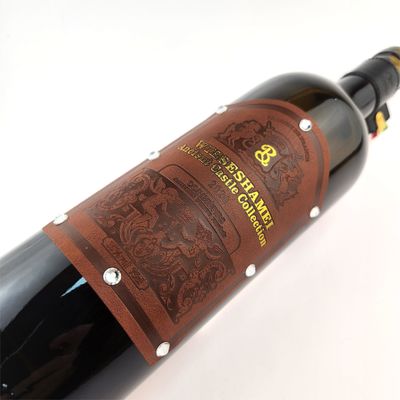 OEM Marca Estampado Etiqueta de cuero de PU Etiqueta personalizada de vino etiquetas de cuero personalizadas pegatina