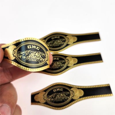 Buen precio Negro Dorado de la banda de cigarrillos personalizados de impresión de pegatinas en relieve pegatina de la banda de papel de oro en relieve en línea