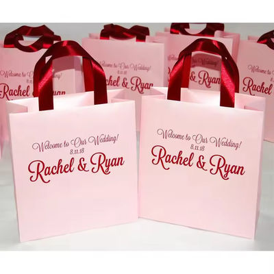 Buen precio Bolsas de regalo personalizadas rosa de vacaciones con efecto 3D Bolsas de compras Kraft Logotipo personalizado en línea