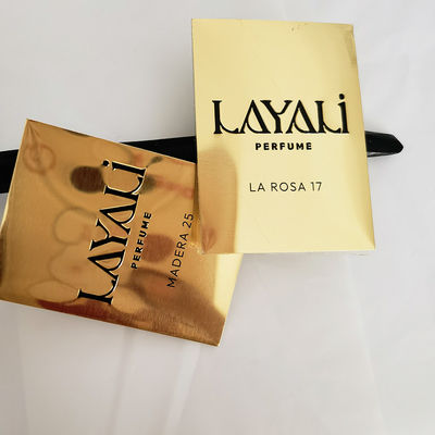 Buen precio Embalaje de perfumes de aluminio metálico de alta gama con pegatinas de rollo de oro en relieve en línea