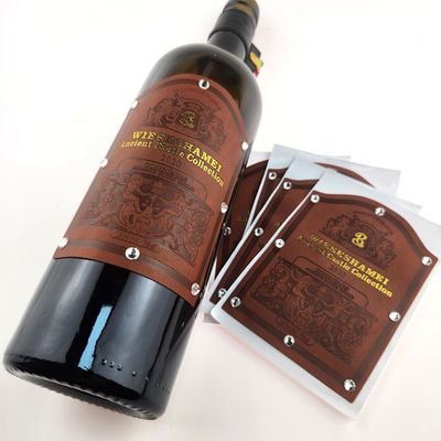 Buen precio Adhesivo de cuero personalizado de impresión autoadhesiva adhesivos de embalaje etiquetas de botellas de vino tinto impresas en línea